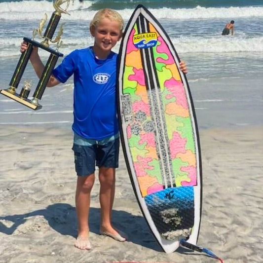 A grom who loves art and surfing glows up his own board! 🌟