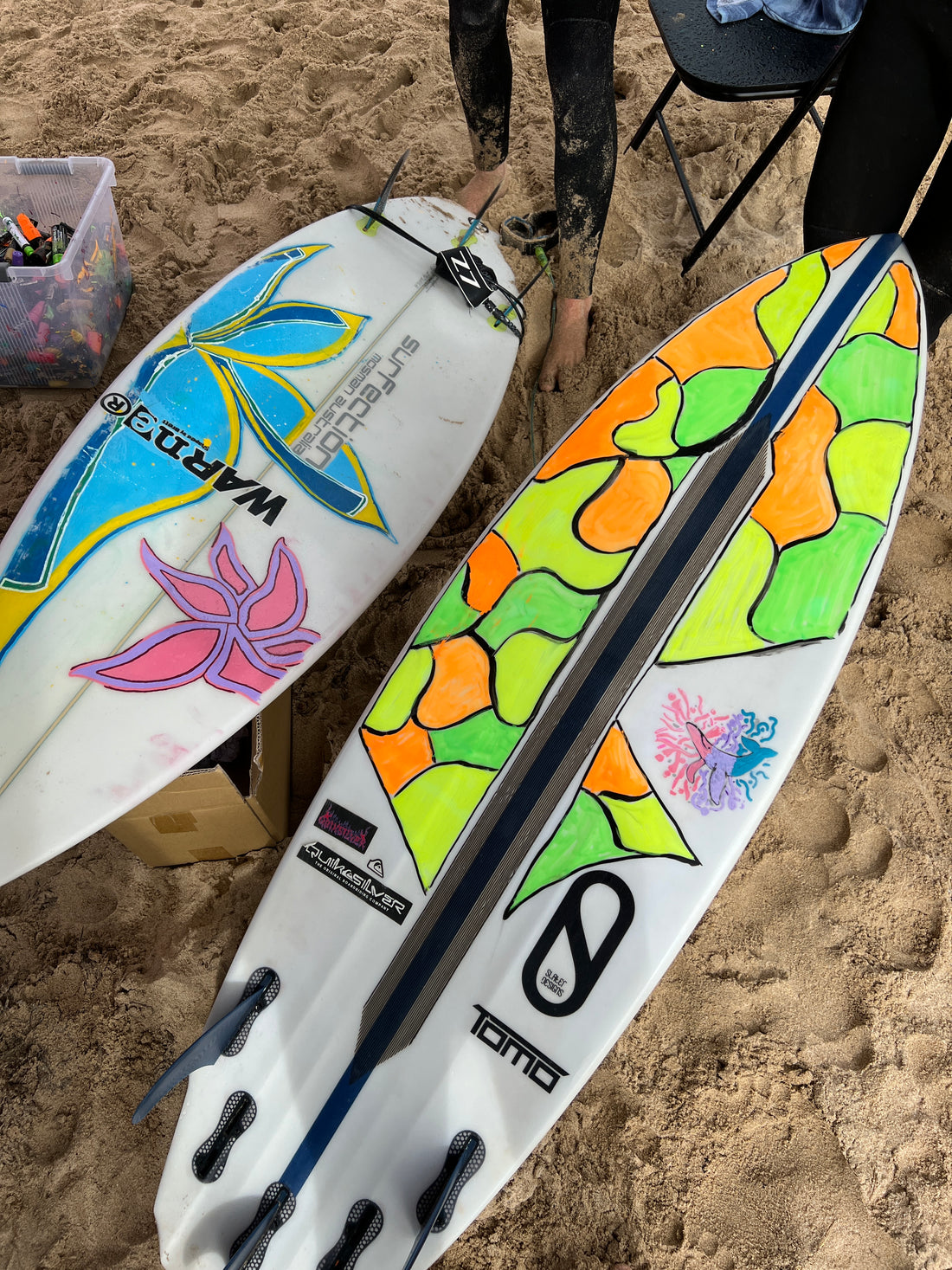 Painting recycled surfboards with Her Wave.