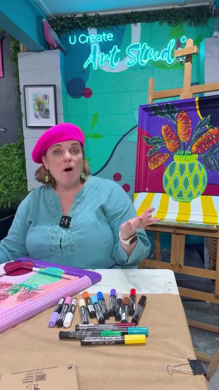 Art educator from U Create Art Studio testing Surfpaints paint pens